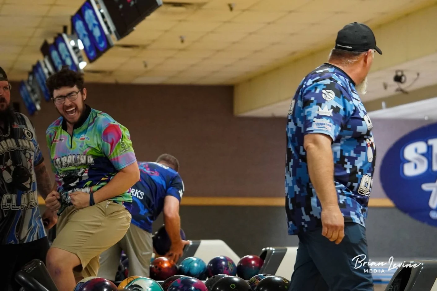 Bowling Federation members celebrating together at a tour stop