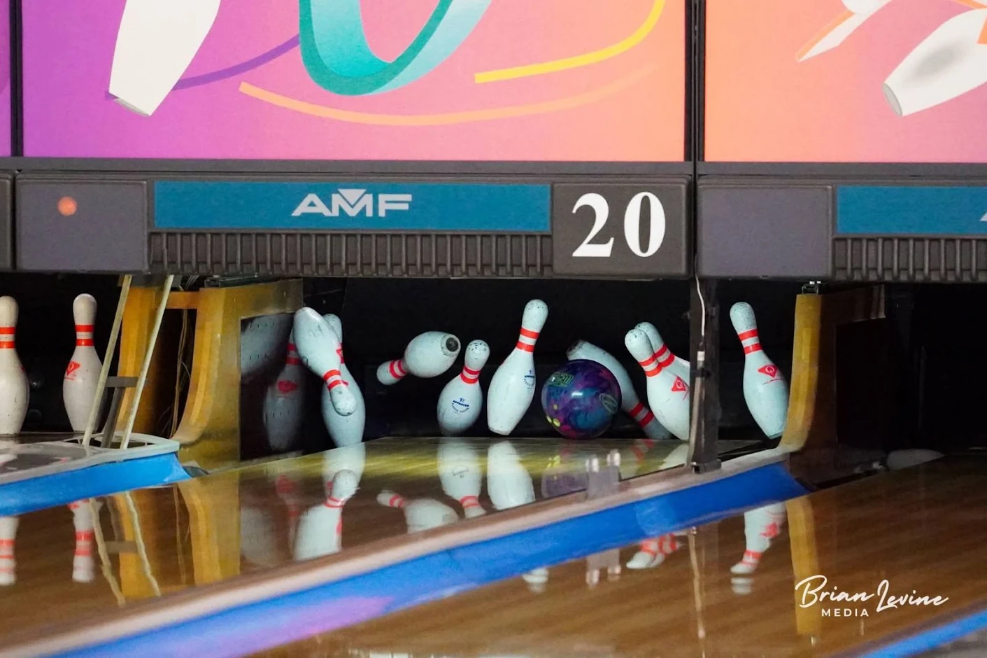 A bowling ball drives through the pocket